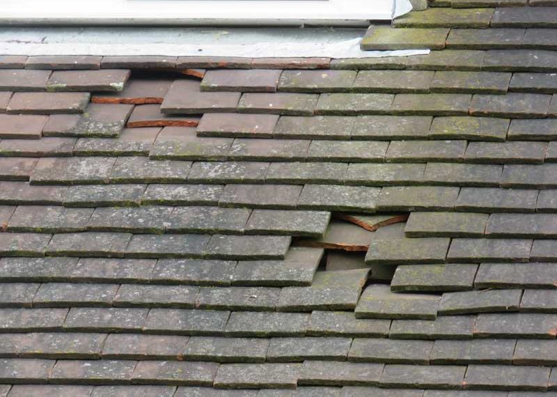 Damaged roof tiles waiting for the best roof repairs in Plymouth, Devon and Cornwall, UK.